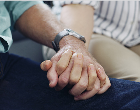 Two people holding hands