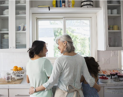 Two women having a conversation in a kitchen