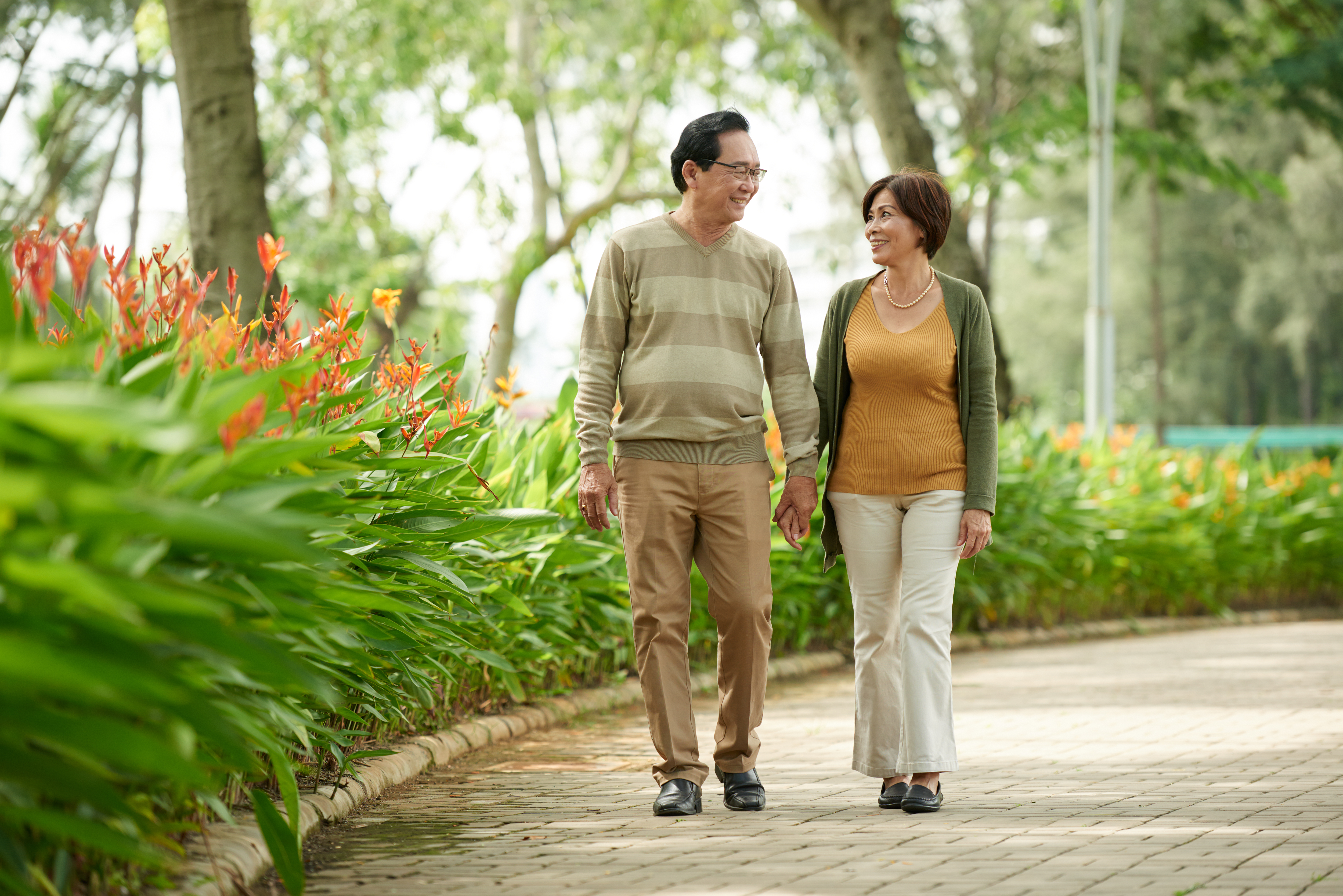 Couple strolling through park