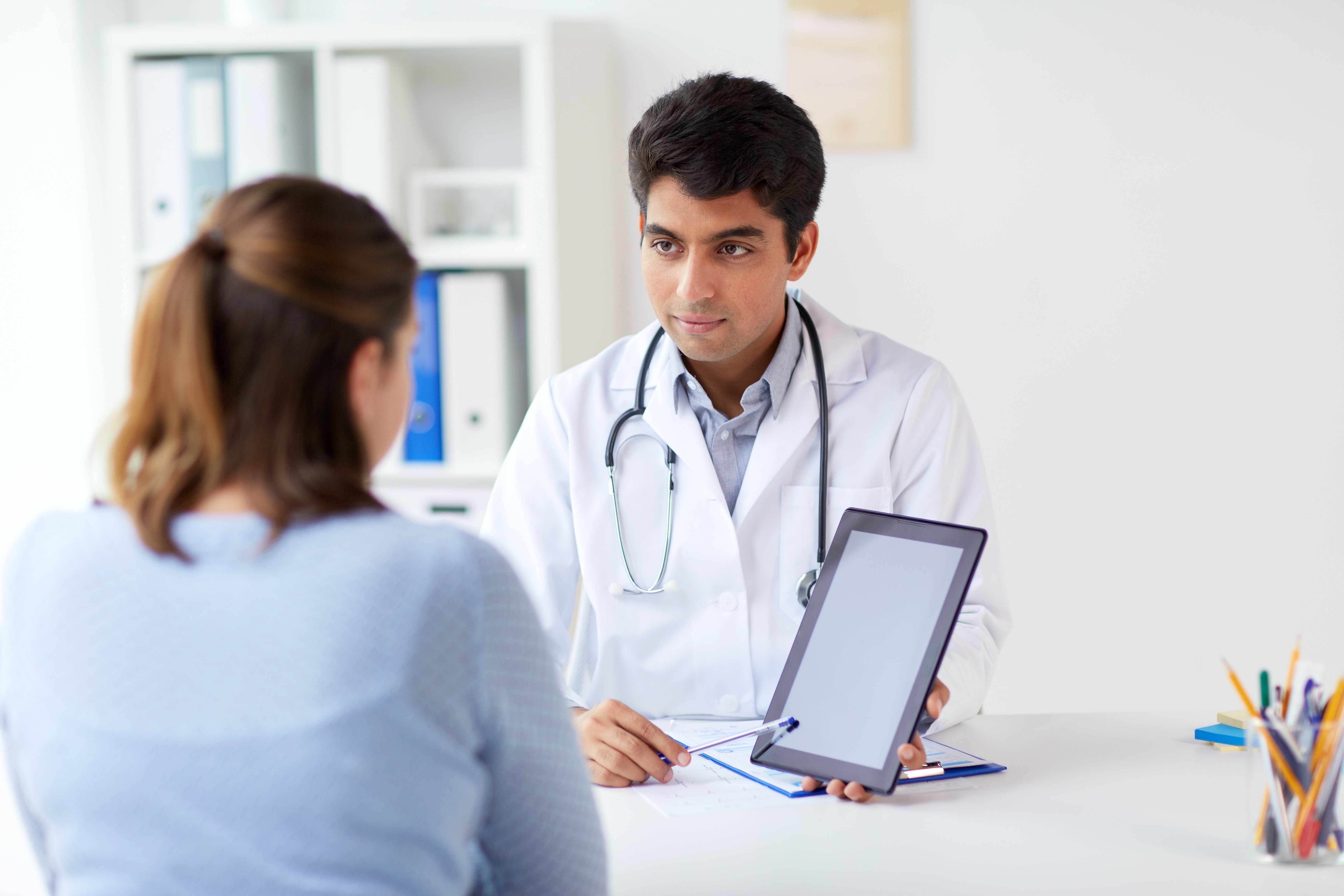 Doctor showing patient information