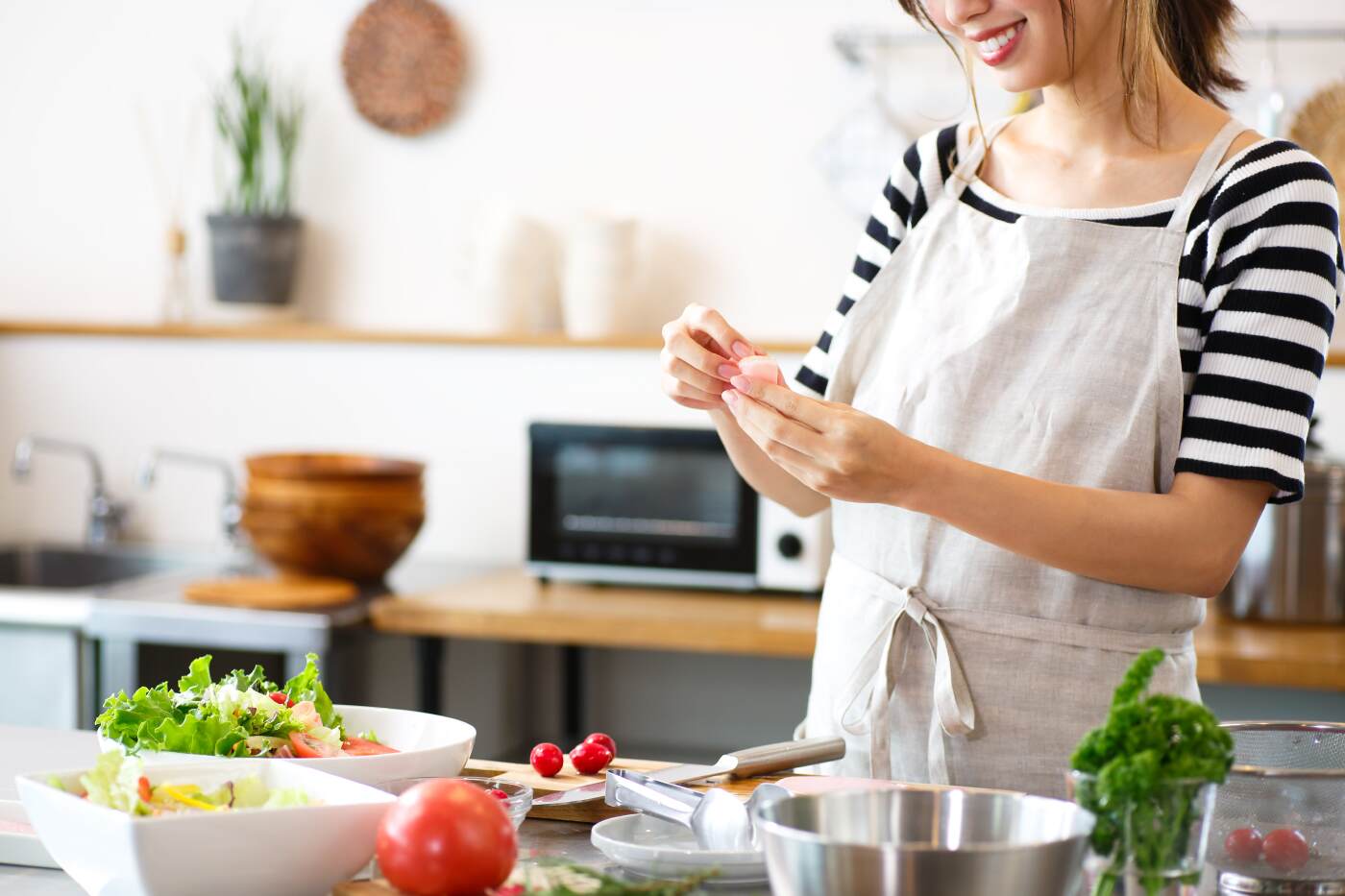 Woman preparing dialysis friendly salad