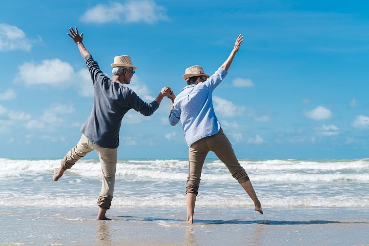 Elderly friends enjoying their time on the beach