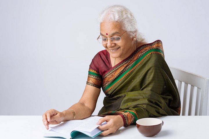 Indian elderly woman reading up on diet for dialysis patients