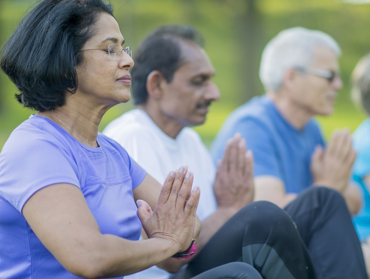 Indian elderly couple exercising with dialysis in the park