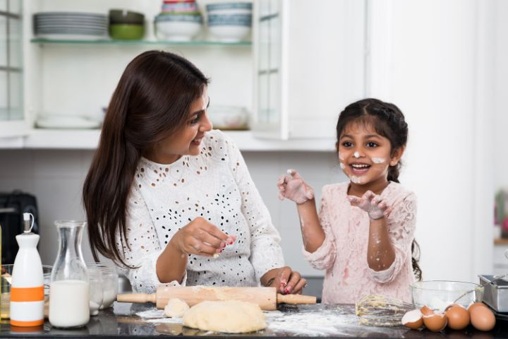 Indian mother and daughter baking kidney friendly pastries for dialysis patients