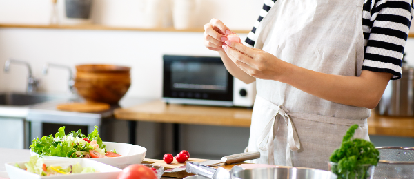Person preparing a salad