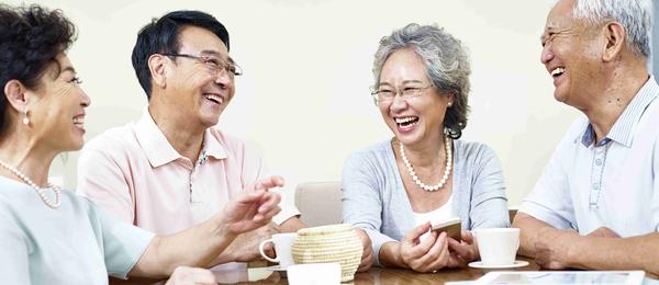 Elderly friends happily talking to each other about living well with dialysis